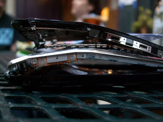 Illustration for article titled Beautiful Destruction: Gallery of Smashed iPhone 3Gs